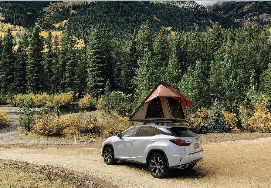 Trustmade Scout MAX Series - Triangular Hard Shell Rooftop Tent assembled on suv at campsite