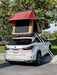 Trustmade Scout MAX Series - Triangular Hard Shell Rooftop Tent assembled on suv with ladder in parking lot