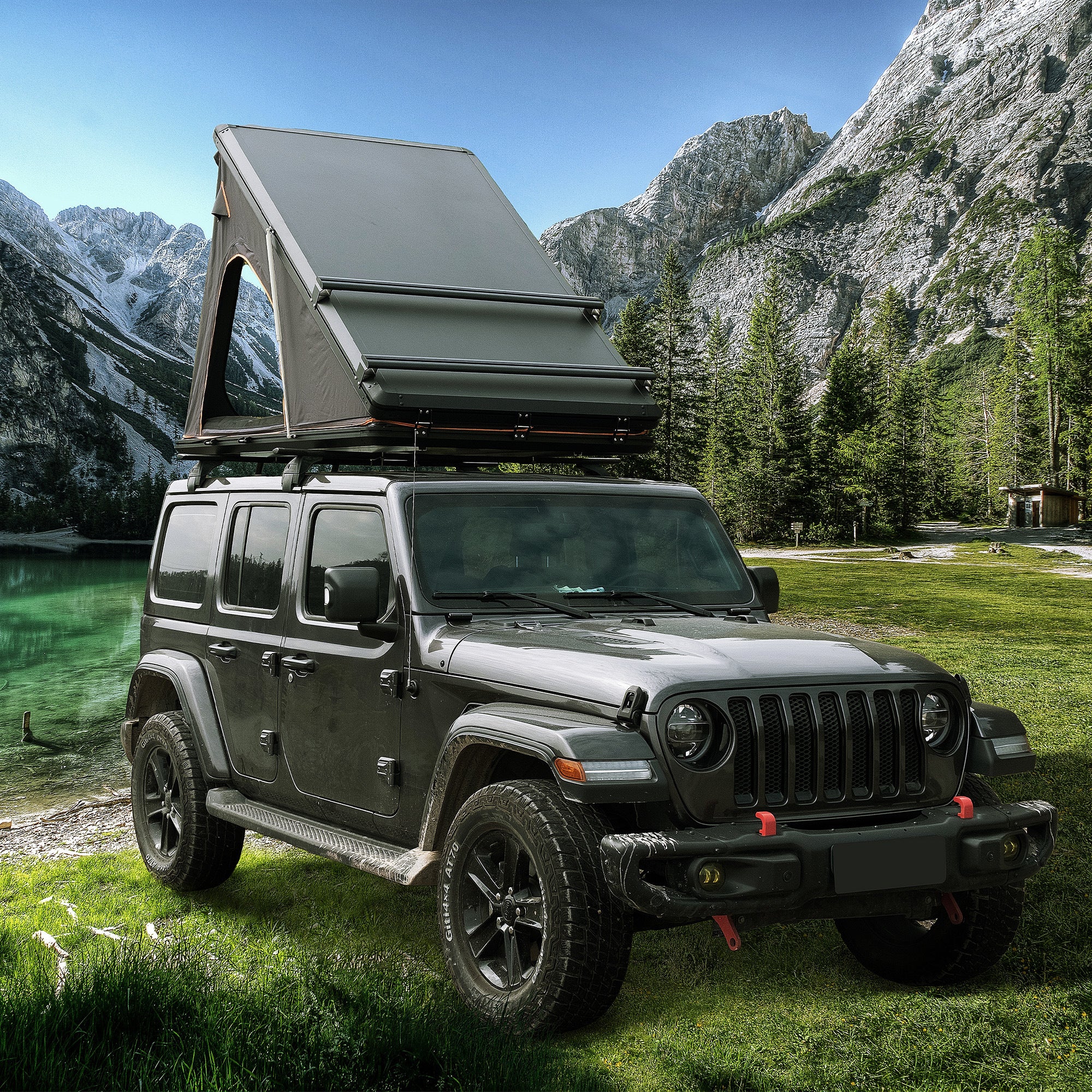 Trustmade Scout Plus Series - Triangular Hard Shell Rooftop Tent with Roof Rack assembled on truck with ladder at mountains