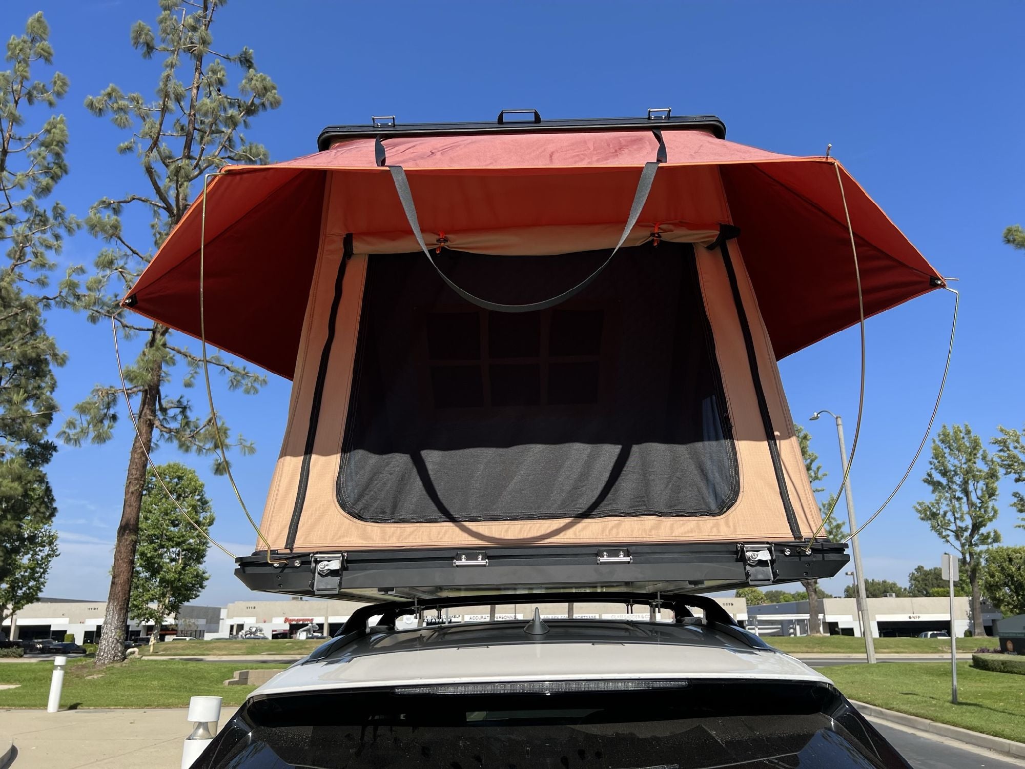 Trustmade Scout MAX Series - Triangular Hard Shell Rooftop Tent assembled on suv rear view outside