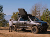 SCOUT DESERT FOREST people closing tent on truck